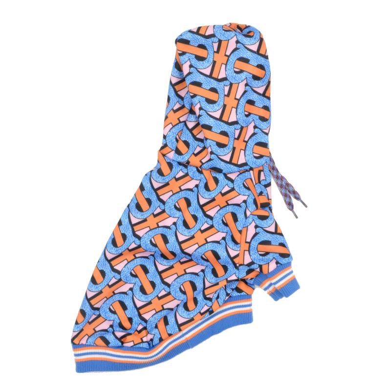 Colorful hoodie with blue, orange, and pink interlocking pattern and striped cuffs