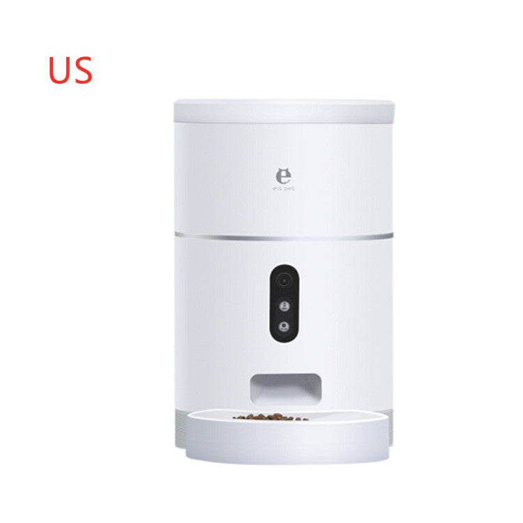 White automatic pet feeder with camera and food bowl dispensing dry kibble on white background