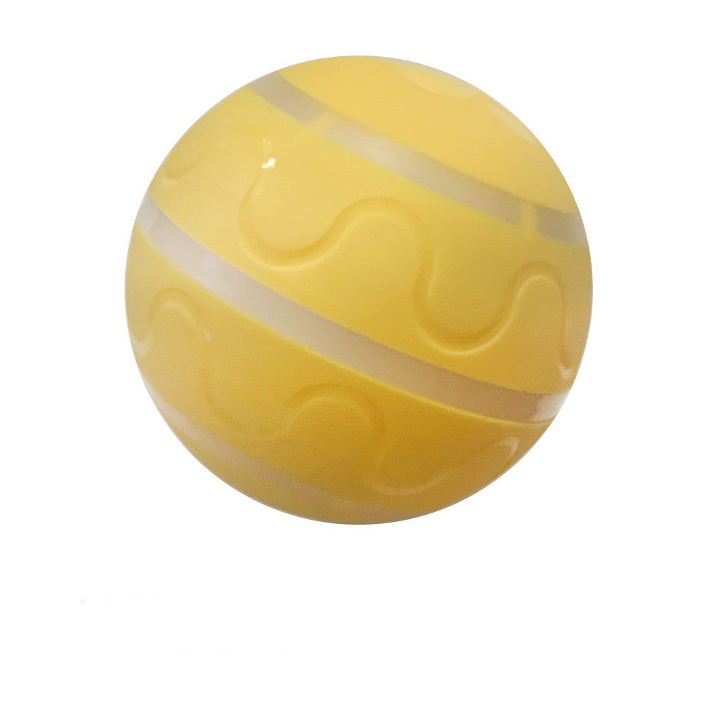 Yellow rubber dog ball with wavy and striped textured patterns on white background