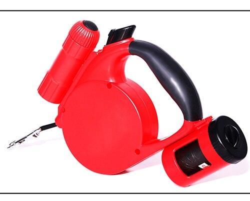 Red and black automatic retractable dog leash with ergonomic handle and waste bag holder
