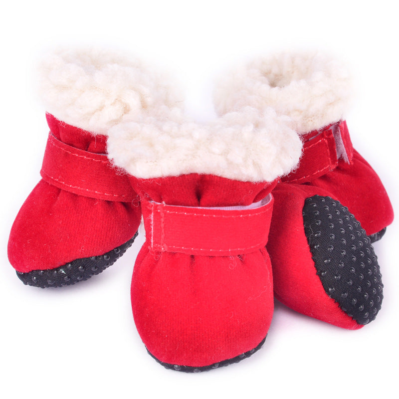 Red fleece dog booties with white soft lining and black non-slip soles