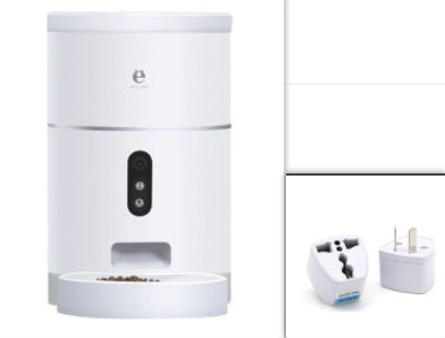White automatic pet feeder dispensing dry food with two international power adapters