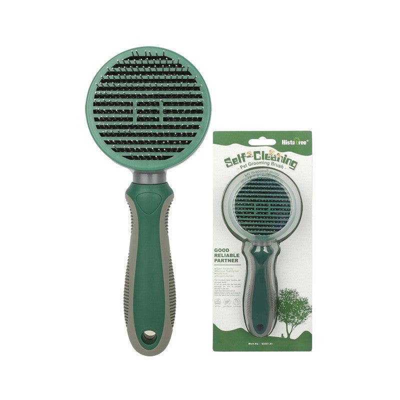 Green self-cleaning pet grooming brush with ergonomic handle and packaging