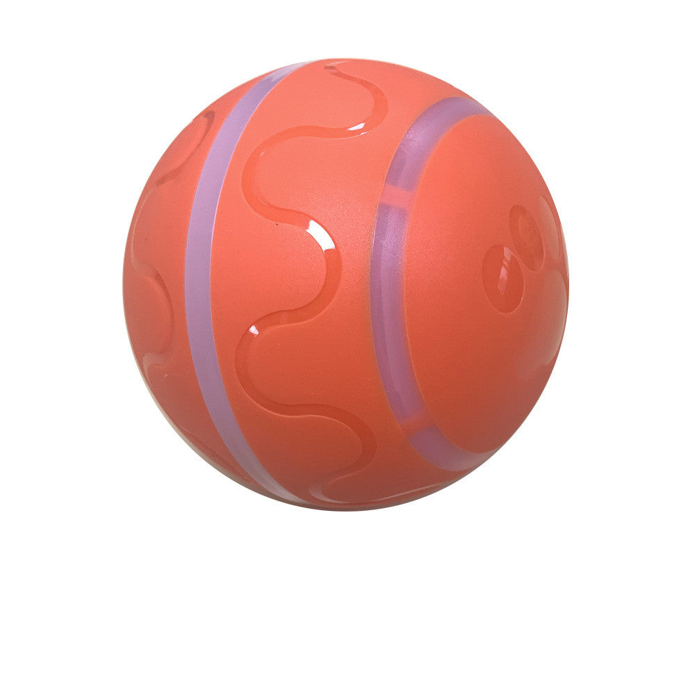 Orange rubber dog ball with purple stripes and paw print design on white background