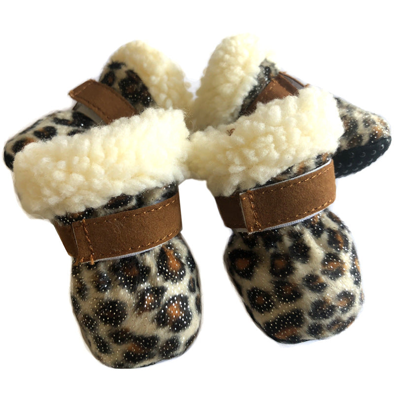 Baby booties with leopard print pattern, soft faux fur lining, and brown adjustable straps